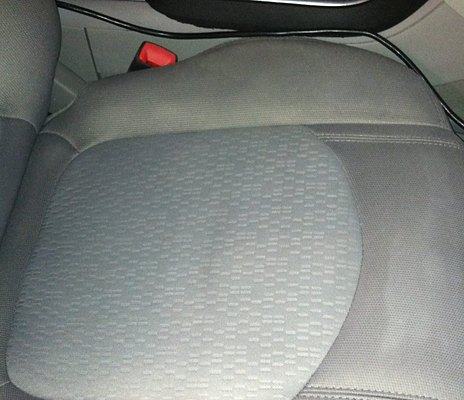 Clean fabric car seat after interior detail