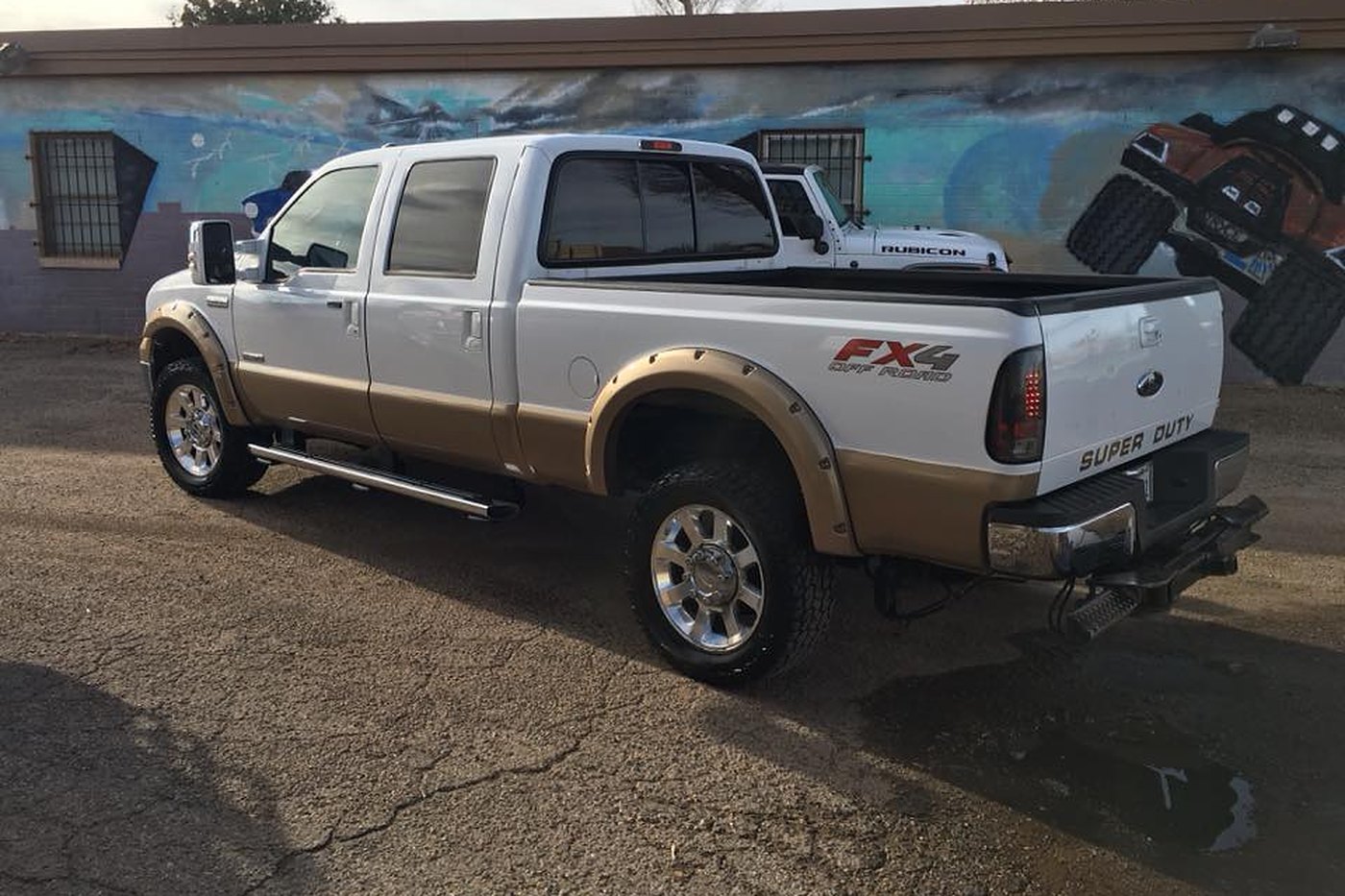 White Ford Super Duty truck from the rear at AJ's Auto Rehab
