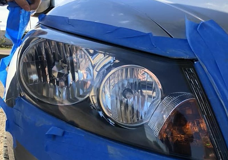 Crystal clear restored headlight on silver car