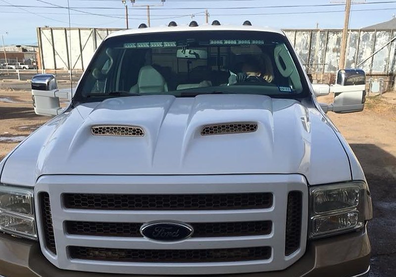 Ford truck windshield being inspected for chips and cracks
